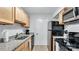 Modern kitchen with granite countertops and stainless steel appliances at 5020 Sardis Rd # I, Charlotte, NC 28270