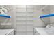 Laundry area with washer, dryer, and ample shelving at 5020 Sardis Rd # I, Charlotte, NC 28270