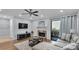 Living room with sectional sofa, fireplace, and balcony access at 5020 Sardis Rd # I, Charlotte, NC 28270