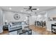 Living room with sectional sofa, dining area, and hardwood floors at 5020 Sardis Rd # I, Charlotte, NC 28270