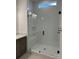 Elegant bathroom with tiled walk-in shower, glass door, and built-in bench at 5213 Mint Harbor Way # 0351, Charlotte, NC 28269