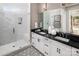 Bathroom with double vanity, marble shower, and geometric floor tile at 5213 Mint Harbor Way # 0351, Charlotte, NC 28269