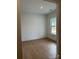 Bright, clean bedroom with hardwood floors and a window with outside view at 5213 Mint Harbor Way # 0351, Charlotte, NC 28269