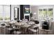 Open concept dining area with modern light fixture and seating for eight at 5213 Mint Harbor Way # 0351, Charlotte, NC 28269
