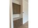 Kitchen nook with custom cabinetry, quartz countertop, and a white tile backsplash at 5213 Mint Harbor Way # 0351, Charlotte, NC 28269