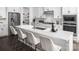 Island kitchen with white cabinets, quartz countertops and stainless steel appliances at 5213 Mint Harbor Way # 0351, Charlotte, NC 28269
