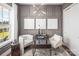 Bright home office features gray paneled walls and plenty of natural light at 5213 Mint Harbor Way # 0351, Charlotte, NC 28269