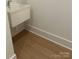 Small interior sink with hardwood floors and white trim at 5213 Mint Harbor Way # 0351, Charlotte, NC 28269