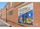 Brick wall with a large mural depicting train travel at 5790 Granbury Dr # B, Kannapolis, NC 28081