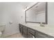 Neutral bathroom with a double sink vanity, and a large mirror at 6000 Carmel Station Ave, Charlotte, NC 28226