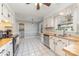 Functional kitchen featuring white cabinets, wood countertops, and stainless steel appliances with natural lighting at 6000 Carmel Station Ave, Charlotte, NC 28226