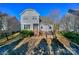 Backyard featuring a lush lawn, patio area with chairs, and a grill for outdoor relaxation and entertaining at 724 Mercer Pl, Huntersville, NC 28078