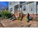 Landscaped backyard featuring a paved patio, comfortable chairs, and an outdoor grill for relaxing gatherings at 724 Mercer Pl, Huntersville, NC 28078