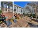 Charming backyard with a paved patio, lounge chairs, and an outdoor grill, perfect for entertaining guests at 724 Mercer Pl, Huntersville, NC 28078