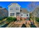 Beautiful backyard featuring a lush lawn, patio area with chairs, and a grill for outdoor enjoyment and gatherings at 724 Mercer Pl, Huntersville, NC 28078
