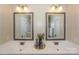 Beautiful bathroom with double sink vanity, decorative mirrors, and modern lighting at 724 Mercer Pl, Huntersville, NC 28078