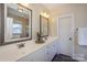 Well-lit bathroom features a double sink vanity with ample counter space and stylish fixtures at 724 Mercer Pl, Huntersville, NC 28078