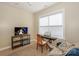 Comfortable bedroom featuring a television, piano, and natural light from a nearby window at 724 Mercer Pl, Huntersville, NC 28078
