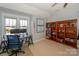 Bright bedroom with an abundance of natural light and a dedicated workspace with a stylish desk and shelving unit at 724 Mercer Pl, Huntersville, NC 28078