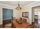 Spacious dining room with hardwood floors and view into kitchen at 724 Mercer Pl, Huntersville, NC 28078