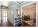 Bright entryway with hardwood floors and view into dining room at 724 Mercer Pl, Huntersville, NC 28078