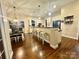 Spacious kitchen with breakfast bar, seating, and white cabinets at 724 Mercer Pl, Huntersville, NC 28078