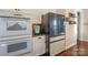 Kitchen boasts stainless steel appliances and granite countertops at 724 Mercer Pl, Huntersville, NC 28078