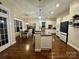 Well-lit kitchen with granite countertops, stainless steel appliances, and breakfast bar at 724 Mercer Pl, Huntersville, NC 28078