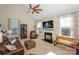 Living room features a fireplace and large TV at 724 Mercer Pl, Huntersville, NC 28078