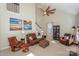 Spacious living room with leather furniture and a ceiling fan at 724 Mercer Pl, Huntersville, NC 28078