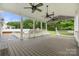 Expansive back porch featuring ceiling fans and views of the fenced-in backyard and neighborhood at 7545 Haley Ln, Indian Land, SC 29707