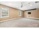 Finished basement features a projector screen and windows for natural light at 7545 Haley Ln, Indian Land, SC 29707