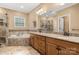 Elegant bathroom featuring a double vanity, soaking tub, and tiled shower enclosure at 7545 Haley Ln, Indian Land, SC 29707