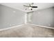 Bedroom features carpet, neutral gray walls, and a fan at 7545 Haley Ln, Indian Land, SC 29707