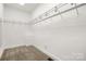 Walk-in closet with adjustable shelving and carpeted floor at 7545 Haley Ln, Indian Land, SC 29707