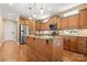 Well-equipped kitchen featuring stainless steel appliances, granite countertops and wooden cabinetry at 7545 Haley Ln, Indian Land, SC 29707