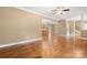 Open-concept living space featuring hardwood floors, white trim and views into kitchen and staircase at 7545 Haley Ln, Indian Land, SC 29707