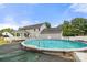 Backyard with a refreshing above-ground swimming pool, surrounded by a deck, and mature trees at 7545 Haley Ln, Indian Land, SC 29707