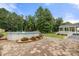 Inviting backyard featuring a refreshing above-ground swimming pool, surrounded by greenery and stone pavers at 7545 Haley Ln, Indian Land, SC 29707