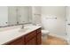 Bathroom with wood vanity and tile flooring at 9153 Leah Meadow Ln, Charlotte, NC 28227