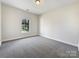 Simple bedroom with neutral walls and carpet flooring at 9153 Leah Meadow Ln, Charlotte, NC 28227