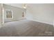 Spacious bedroom with grey carpet and dual windows at 9153 Leah Meadow Ln, Charlotte, NC 28227