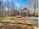 House exterior features stone accents and teal shutters at 9153 Leah Meadow Ln, Charlotte, NC 28227