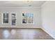 Gathering room with French doors leading to deck at 9153 Leah Meadow Ln, Charlotte, NC 28227