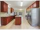 Kitchen with island, granite countertops, and wood cabinets at 9153 Leah Meadow Ln, Charlotte, NC 28227