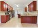 Kitchen with dark wood cabinets and granite countertops at 9153 Leah Meadow Ln, Charlotte, NC 28227