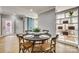 Bright dining area with round table and rustic chairs near kitchen at 9439 Bonnie Briar Cir, Charlotte, NC 28277