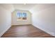 Bright bedroom featuring wood-look floors and a window at 0000 Crown Ter, Hickory, NC 28601