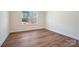 Simple bedroom with wood-look floors and a window at 0000 Crown Ter, Hickory, NC 28601