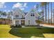 Two-story home with gray siding, stone accents, and a landscaped lawn at 0000 Crown Ter, Hickory, NC 28601